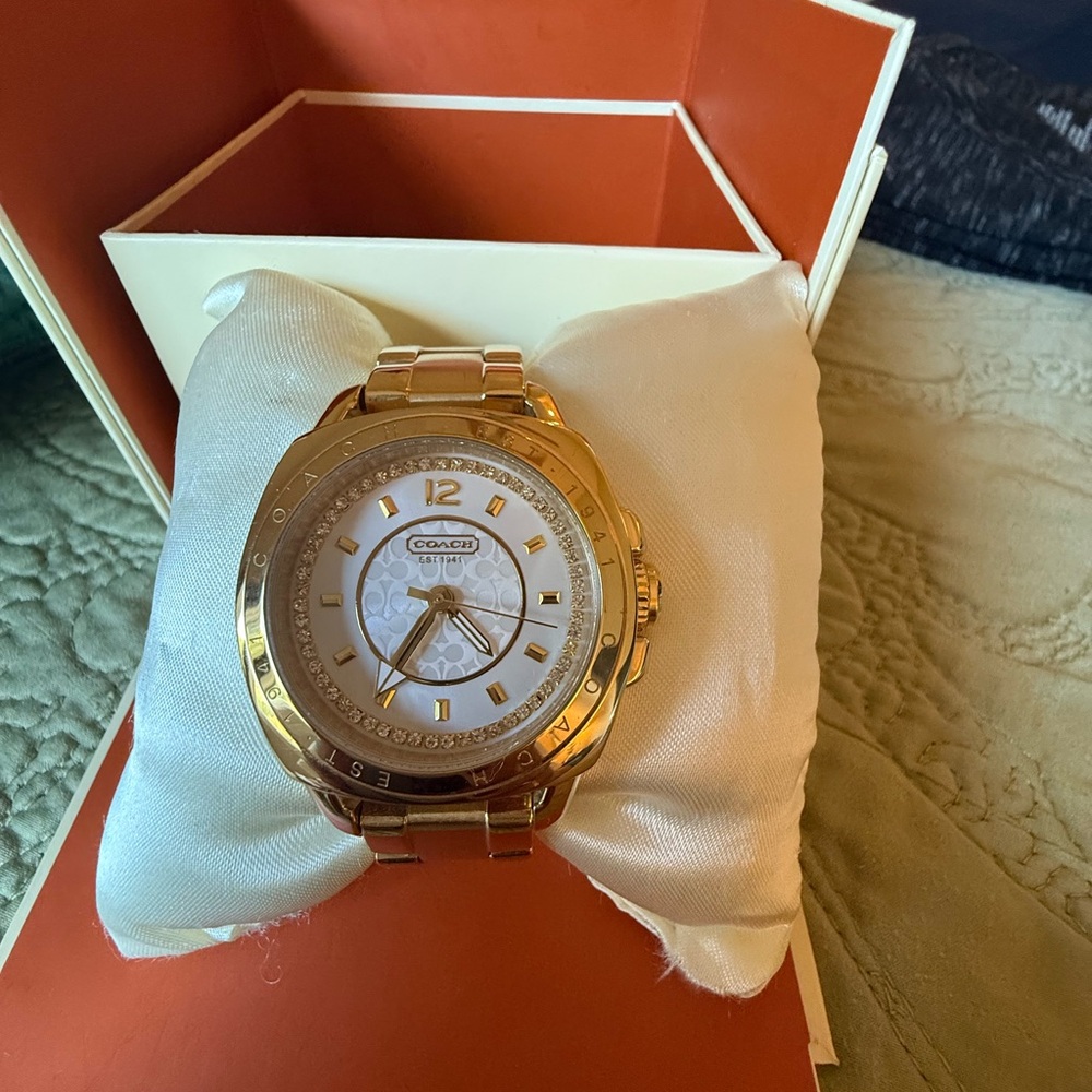 Coach Gold Watch with mother pearl face and Swarovski crystals.
